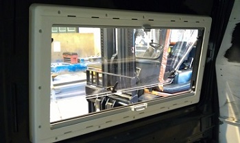 Inner window section screwed in place